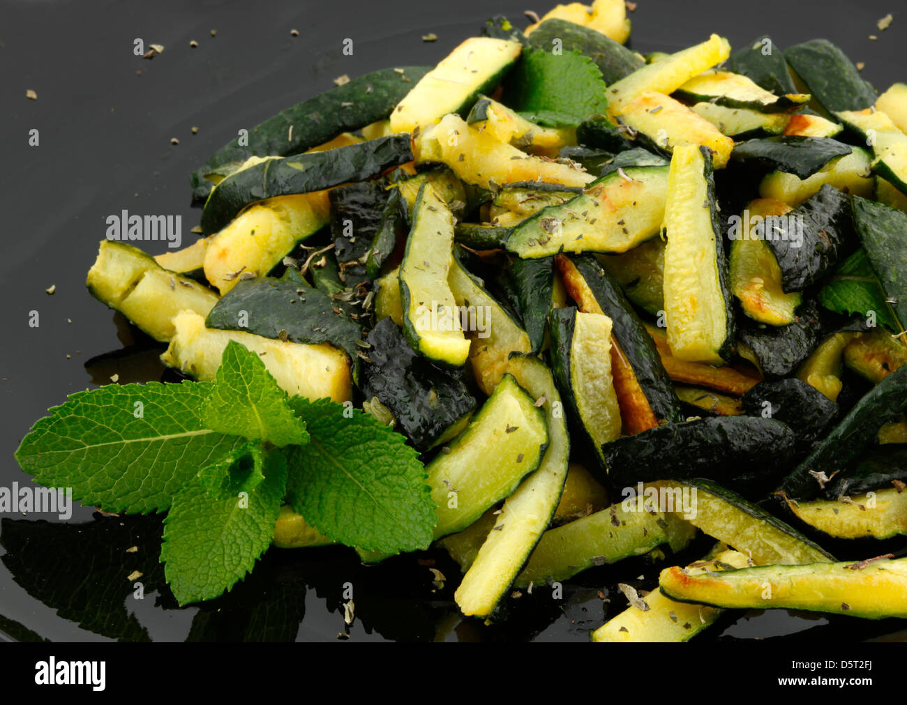 Sauteed zucchinis with mint leaf Stock Photo Alamy