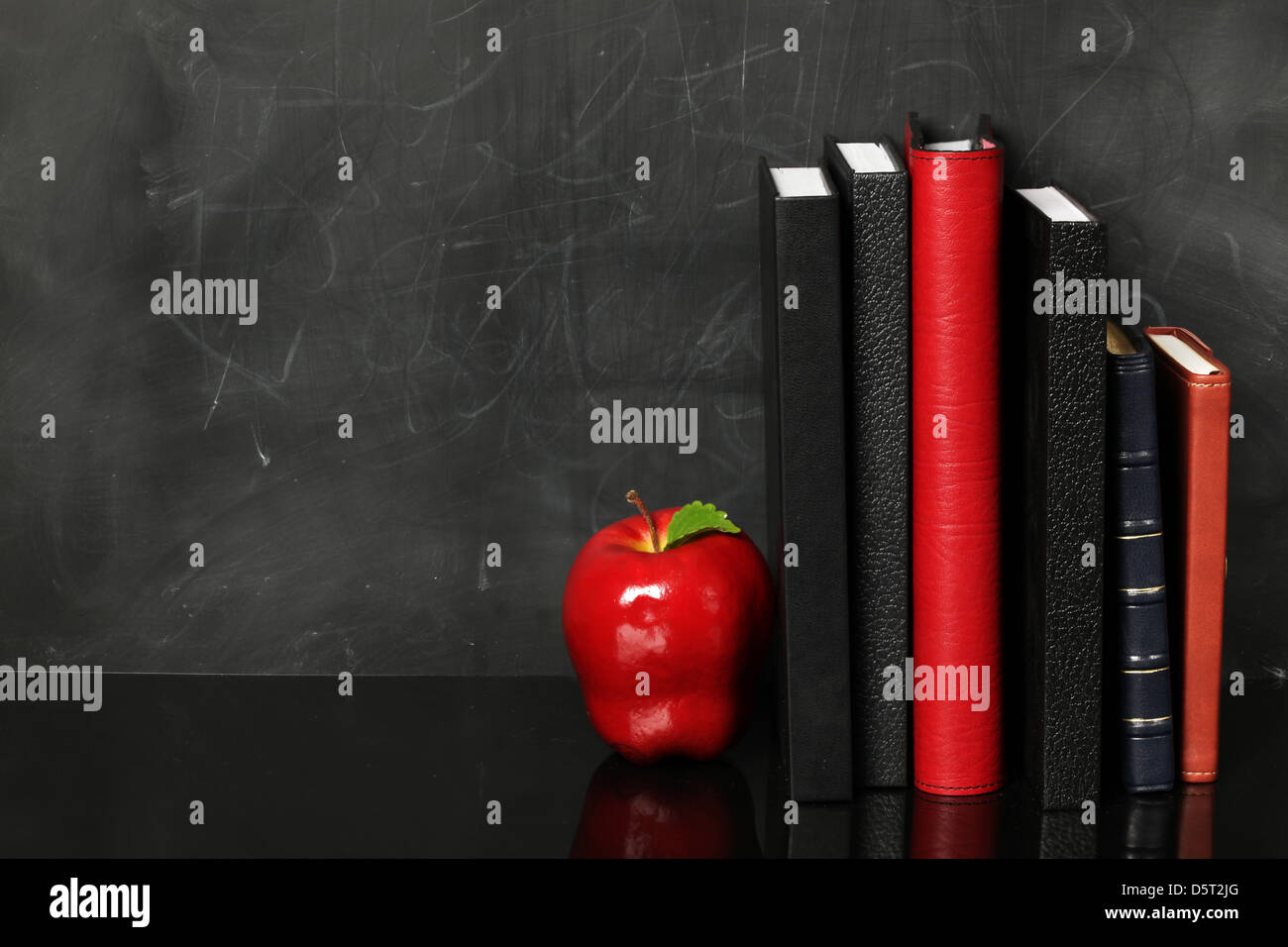 Blank chalkboard with books Stock Photo