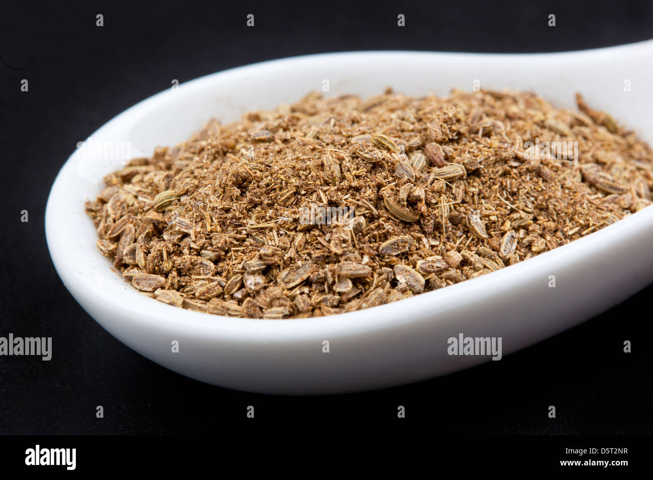 Fennel seeds and ground coriander on a black background Stock Photo