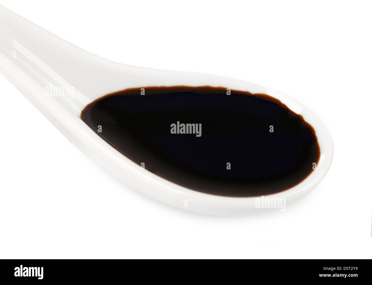 Balsamic vinegar in white ceramic spoon Stock Photo Alamy