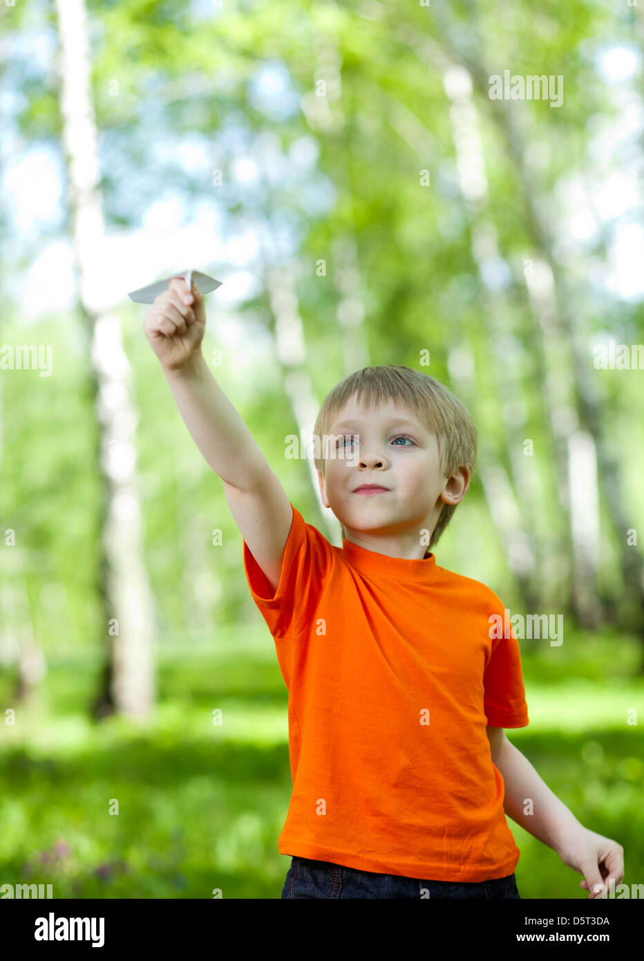 Children playing and flying a paper airplane Stock Photo - Alamy