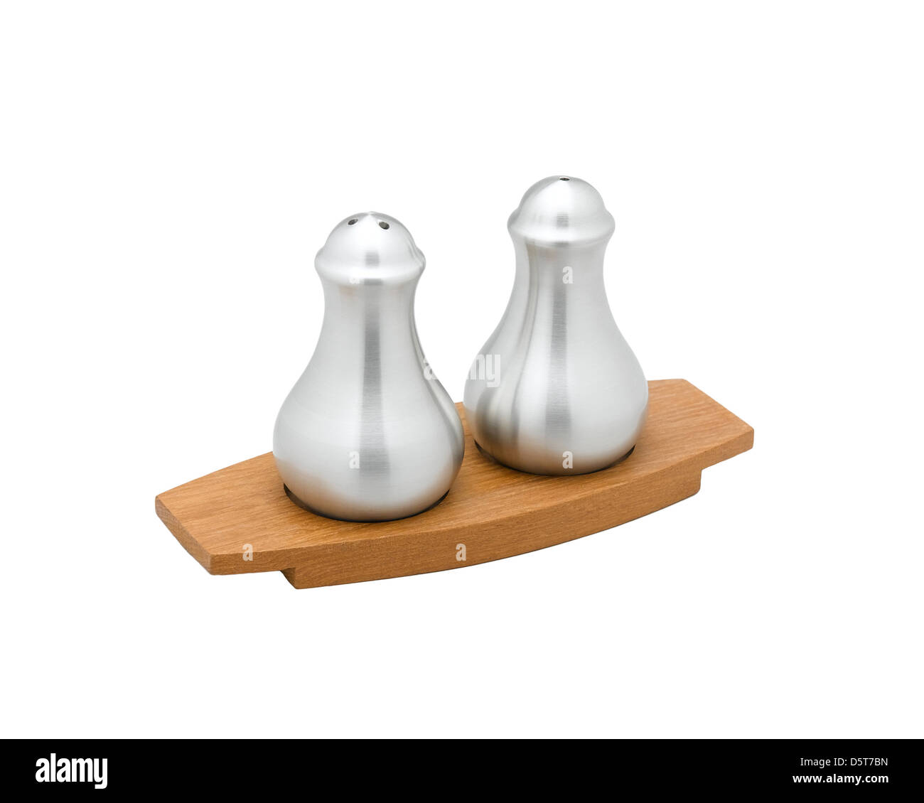 A pair of salt and pepper bottle on teak wood tray nice to put on your dinner table Stock Photo