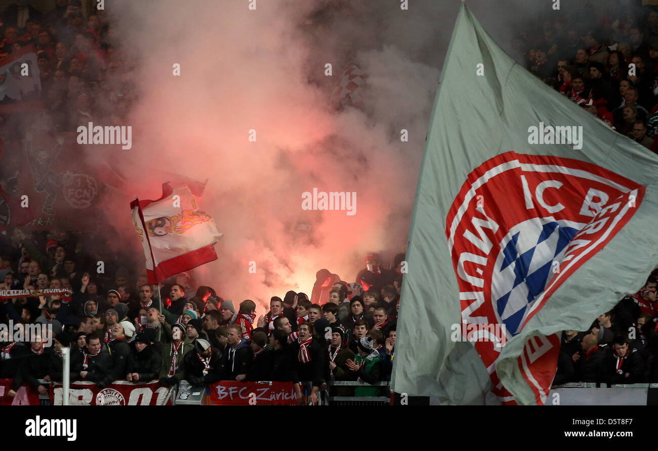 Bayern Munich fans light flares during the Bundesliga soccer match