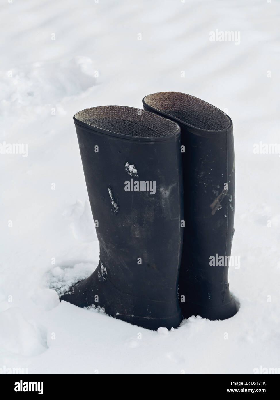 Boots in Snow Stock Photo - Alamy