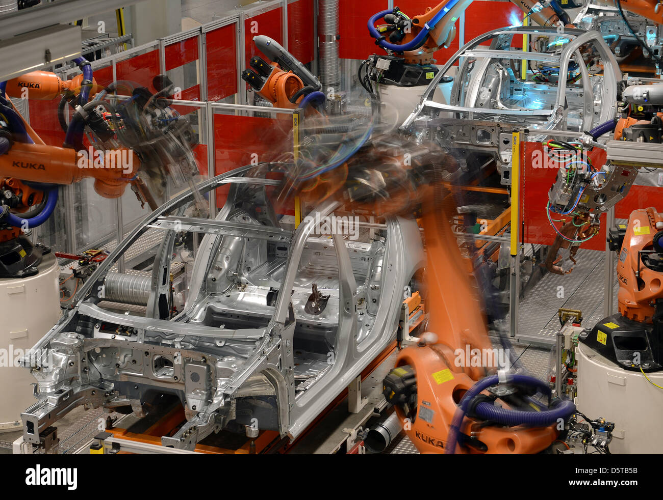 Welding robots assemble the body of the new Golf 7 at the VW plant in