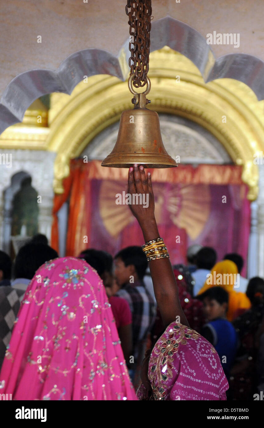 India Bell Ringing Believers ring a bell upon entering a Hindu temple in Jaipur, India, 16 ...