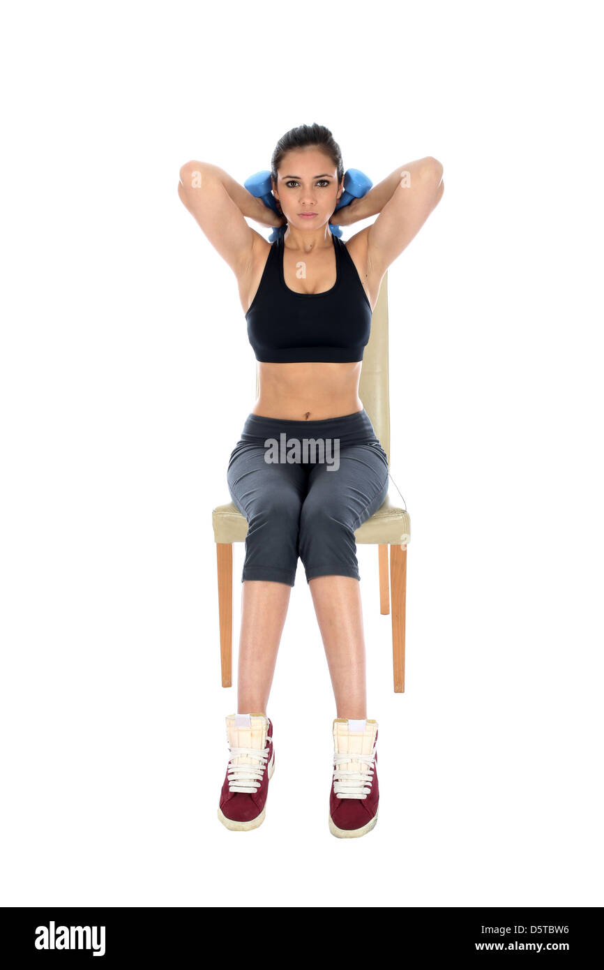 Determined Confident Positive Young Woman Performing Tricep Extensions Exercises Sitting On Chair Isolated Against A White Background With Copy Space Stock Photo Alamy