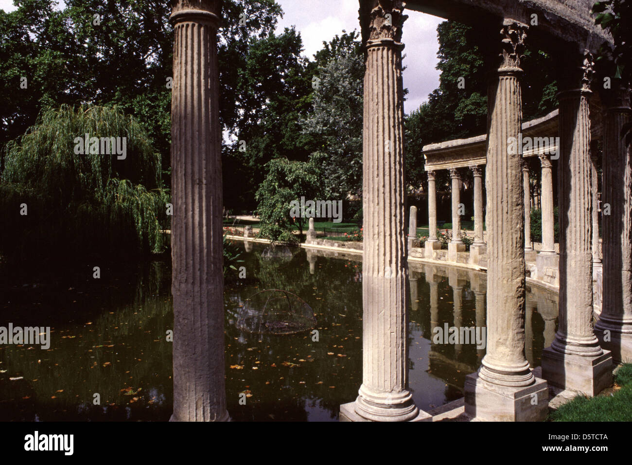 Colonnade beside Naumachia basin in Parc de Monceau park situated in the 8th and 17th Arrondissements of Paris France Stock Photo