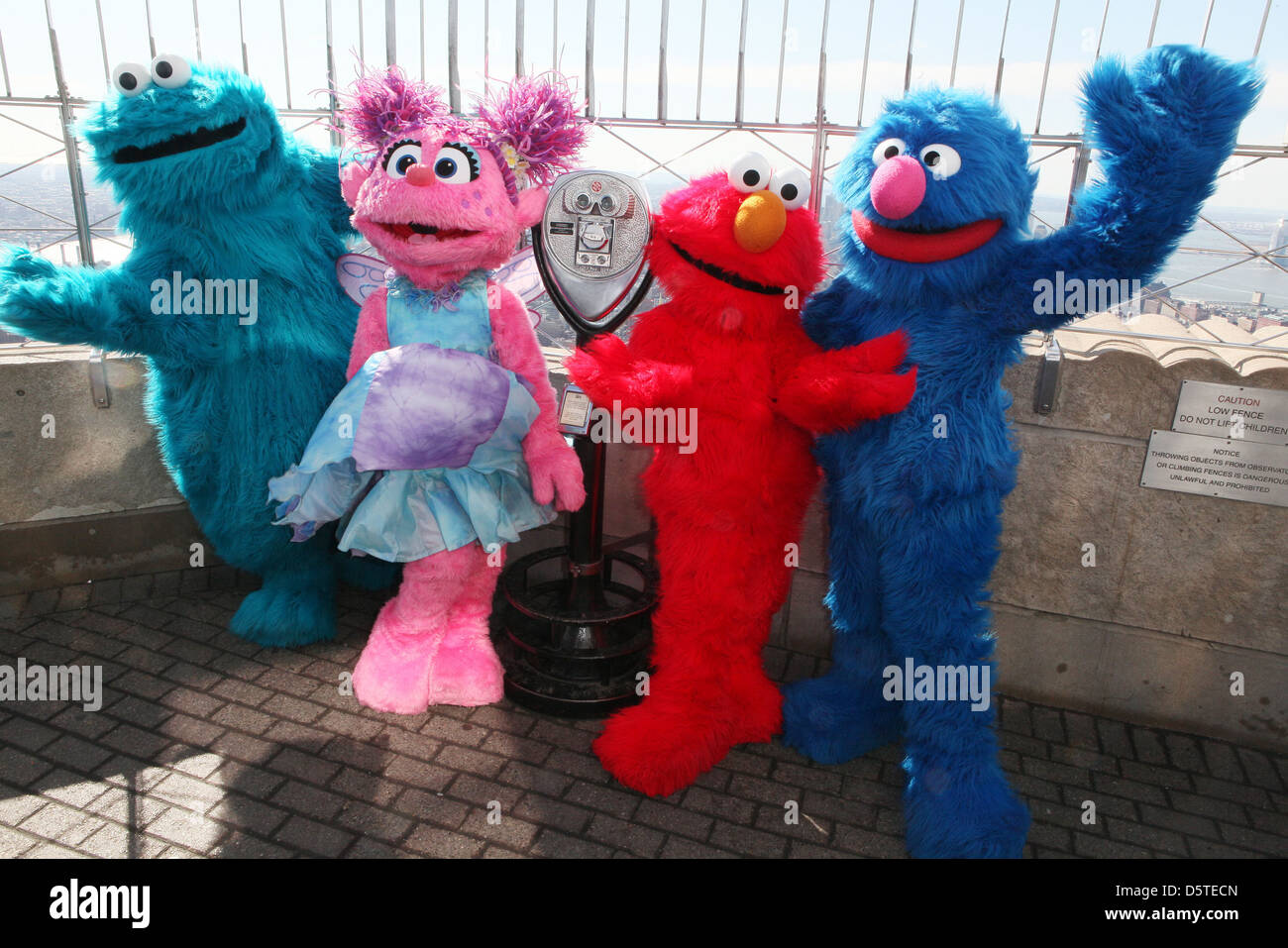 Cookie Monster, Abby Cadabby, Elmo Grover characters visit the top of the Empire State Building to promote Stock Photo - Alamy