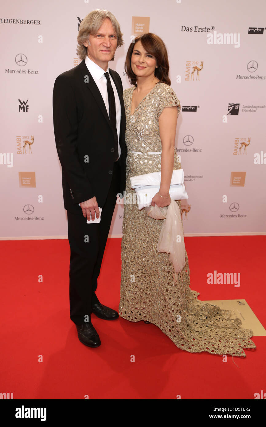 German actress Barbara Auer and partner Martin Langer arrive at the Bambi award ceremony 2012 in Duesseldorf, Germany, 22 November 2012. The Bambis are the main German media awards and are presented for the 64th time. Photo: Jörg Carstensen/dpa Stock Photo
