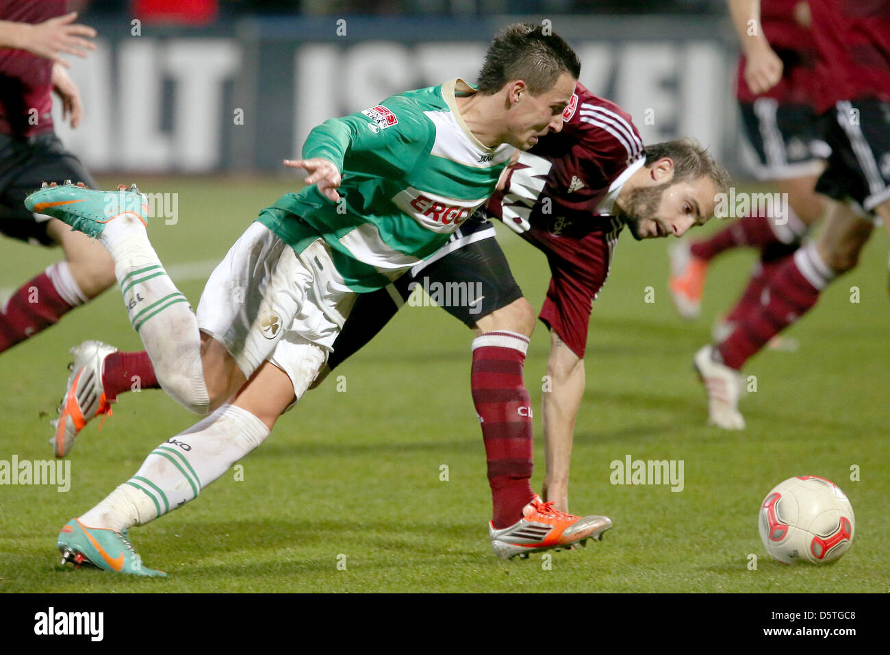 Fuerth's Edgar Prib (L) vies for tzhe ball Nuremberg's Javier Pinola during the German Bundesliga match between SpVgg Greuther Fuerth and 1. FC Nuremerg at Trolli Arena in Fuerth, Germany, 24 November 2012. Photo: DANIEL KARMANN  (ATTENTION: EMBARGO CONDITIONS! The DFL permits the further utilisation of up to 15 pictures only (no sequntial pictures or video-similar series of pictur Stock Photo