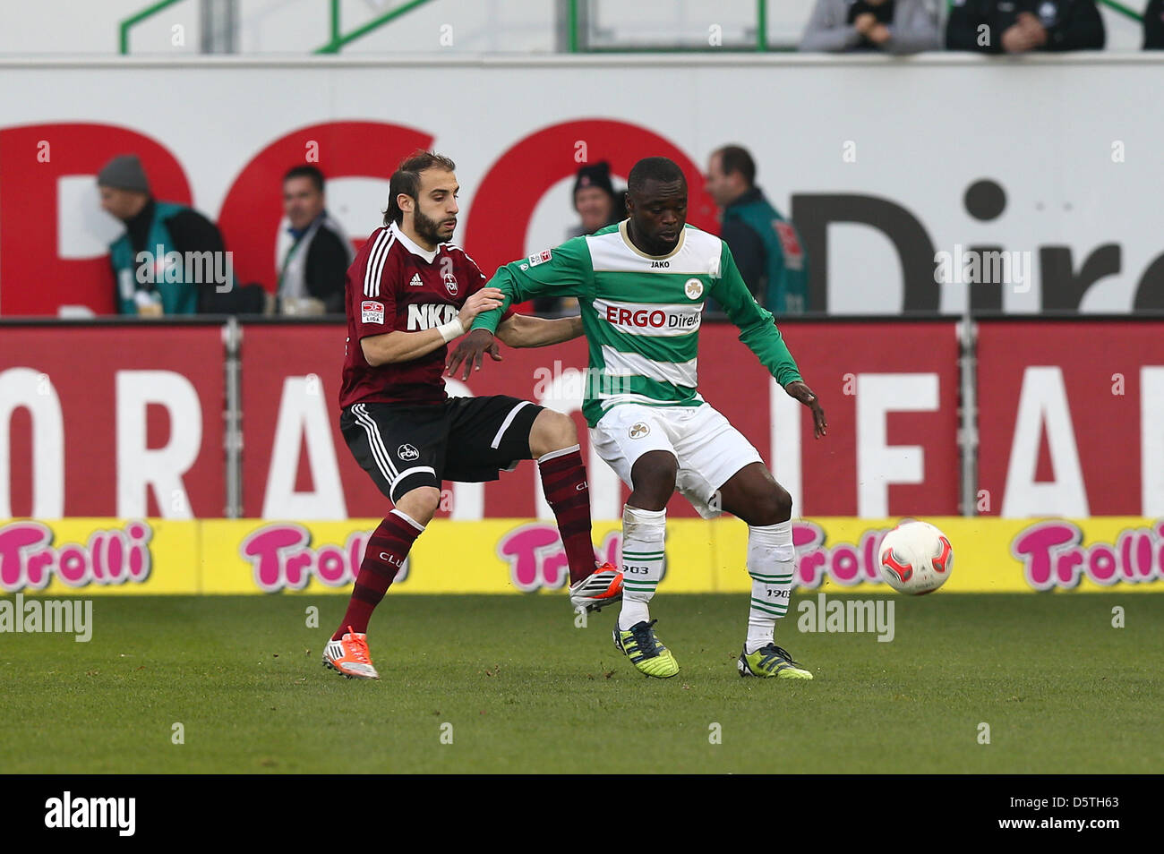 Fuerth's Gerald Asamoah (R) and Nuremberg's Javier Pinola vie for the ball during the German Bundesliga soccer match SpVgg Greuther Fuerth vs 1. FC Nuremberg at Trolli Arena in Fuerth, Germany, 24 November 2012. The match ended 0:0. Photo: Revierfoto Stock Photo