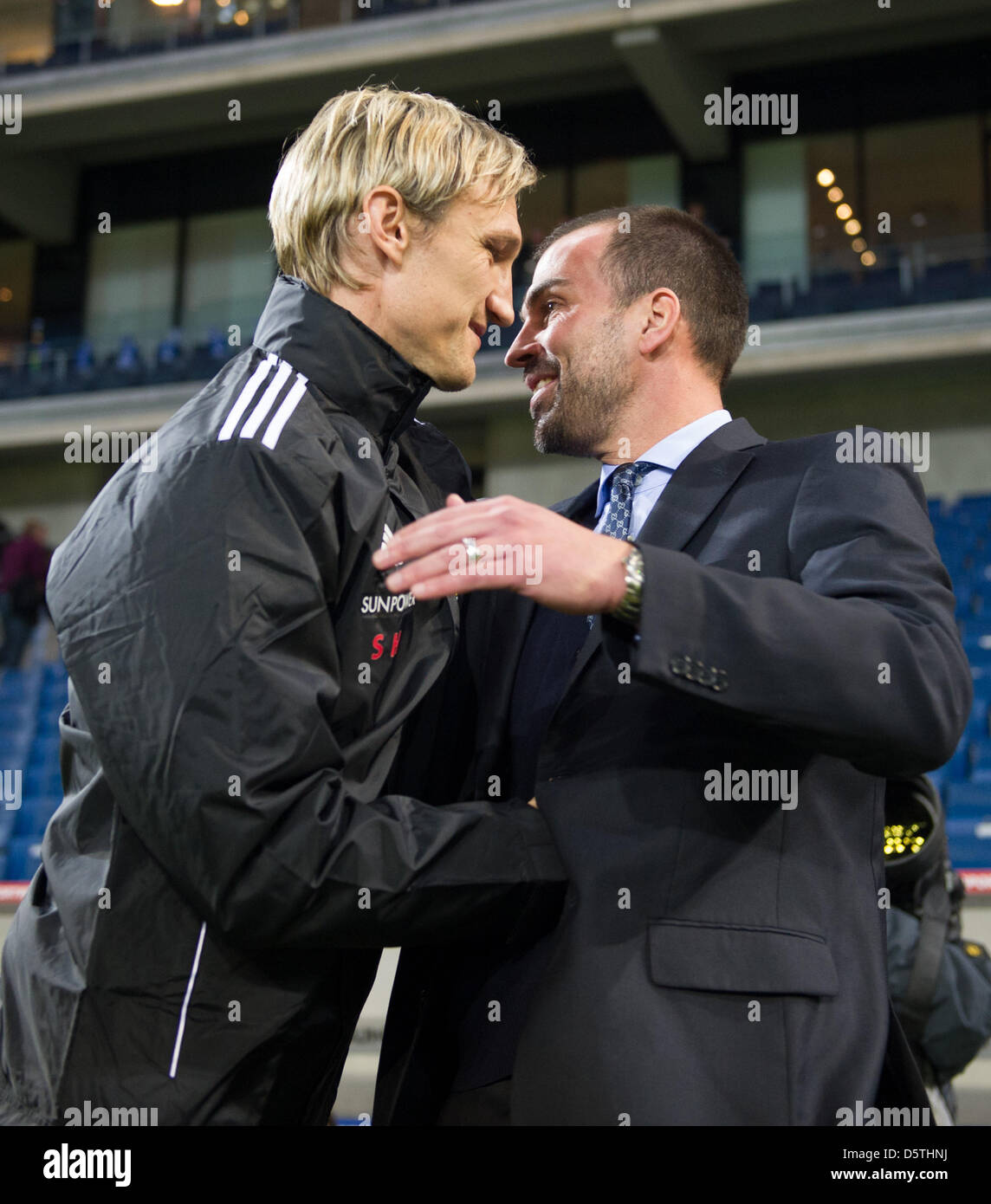 Hoffenheim's head coach Markus Babbel (R) and Leverkusen's team chef Sami Hyypia shake hands prior to the German Bundesliga soccer match 1899 Hoffenheim vs Bayer 04 Leverkusen at Rhein Neckar Arena in Sinsheim, Germany, 25 November 2012. Photo: Uwe Anspach  (ATTENTION: EMBARGO CONDITIONS! The DFL permits the further utilisation of up to 15 pictures only (no sequntial pictures or vi Stock Photo