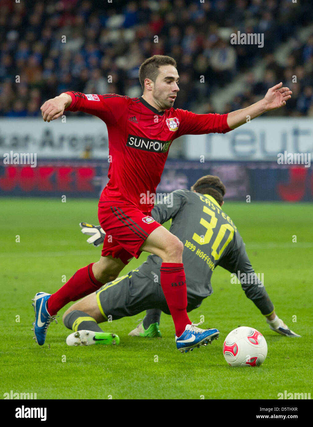 Leverkusen's Daniel Carvajal (FRONT) scores the 0:2 against Hoffenheim's goalkeeper Koen Casteels during the German Bundesliga soccer match 1899 Hoffenheim vs Bayer 04 Leverkusen at Rhein Neckar Arena in Sinsheim, Germany, 25 November 2012. Photo: Uwe Anspach  (ATTENTION: EMBARGO CONDITIONS! The DFL permits the further utilisation of up to 15 pictures only (no sequntial pictures or Stock Photo