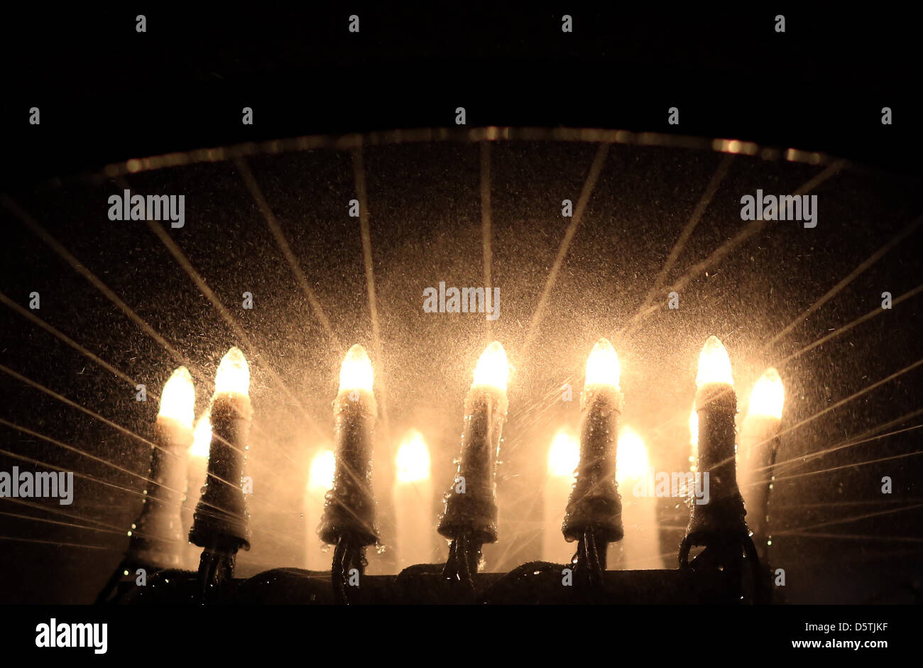 Christmas lights are watered to test their resistance to spray rain at