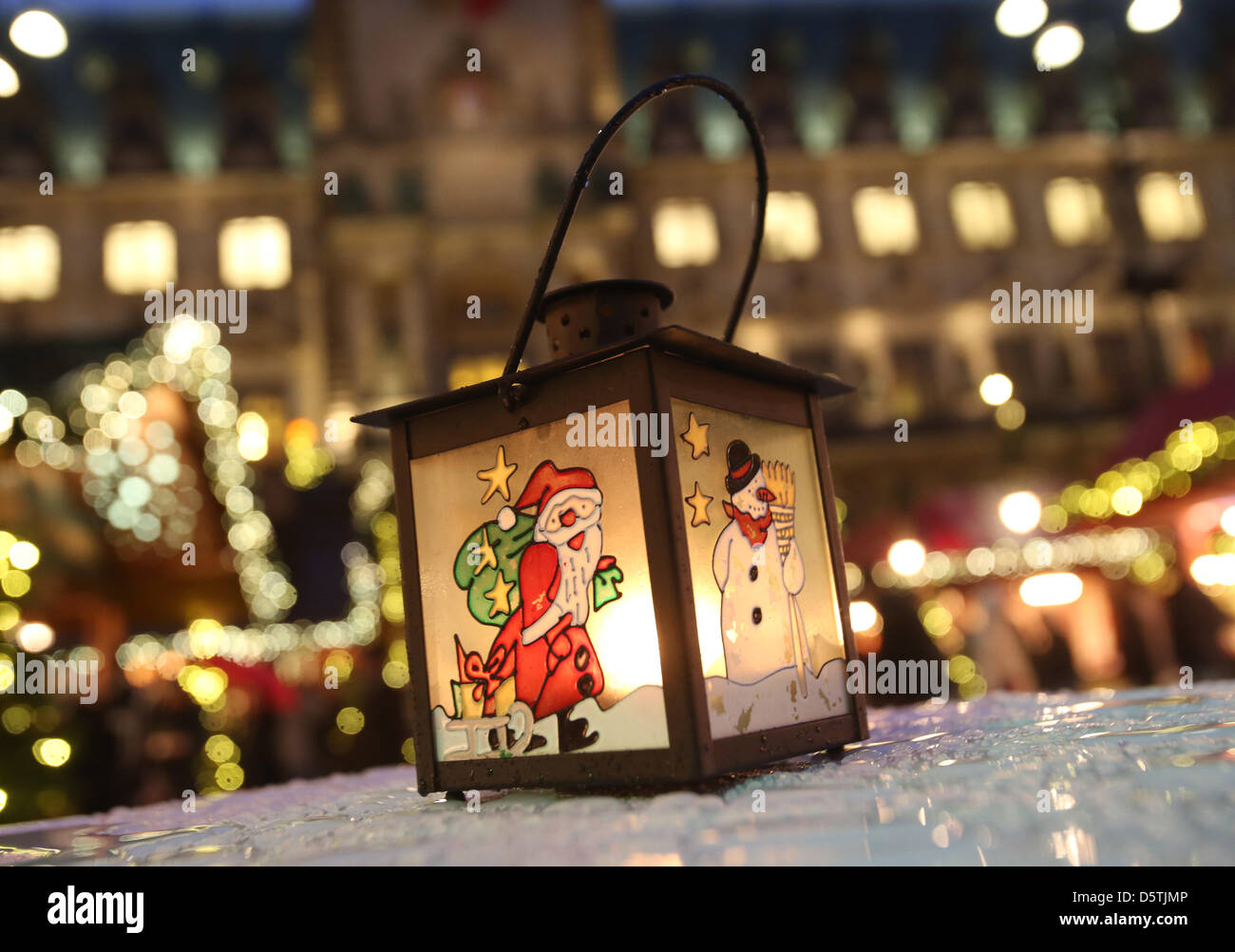 A christmas light with santa and snowman decoration is pictured on the christmas market in front of the city hall in Hamburg, Germany, 26 November 2012. Eleven christmas markets are opening in Hamburg on this day. Photo: Christian Charisius Stock Photo