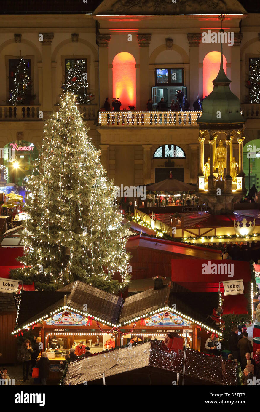 The christmas market with illuminated lights, booths and a tree is pictured at the city hall in Magdeburg, Germany, 26 November 2012. The market offers 135 booths which will be open until 20 December 2012. Photo: Jens Wolf Stock Photo