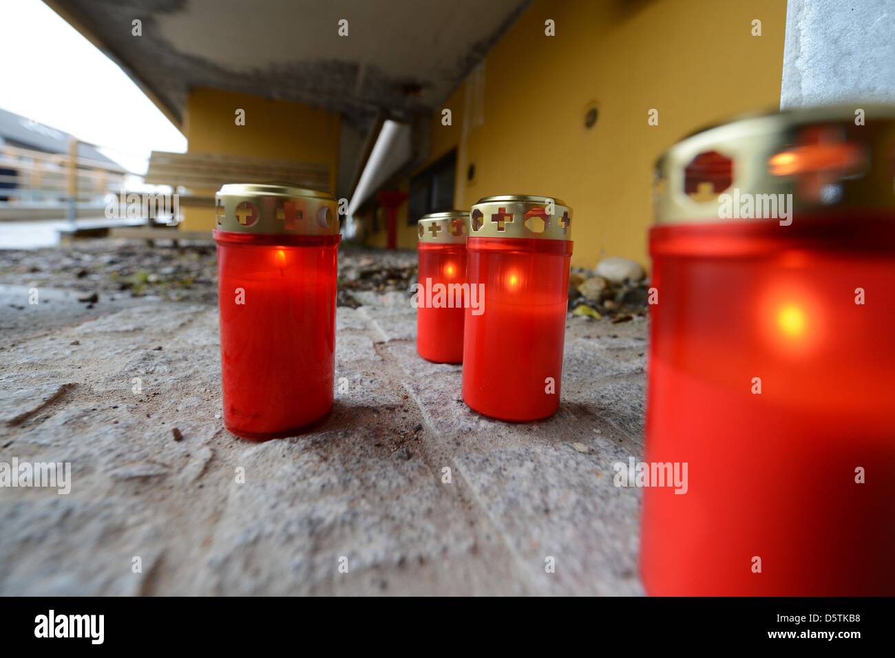 Candles are lit up at a workshop for people with disabilities in Titisee-Neustadt, Germany, 27 November 2012. 14 people were killed on 26 November when a fire spread through the workshop. Photo: FELIX KAESTLE Stock Photo