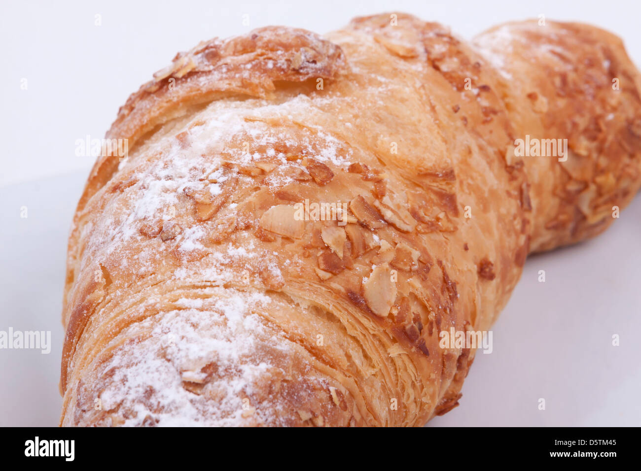 fresh almond croissant isolated on a white background Stock Photo - Alamy