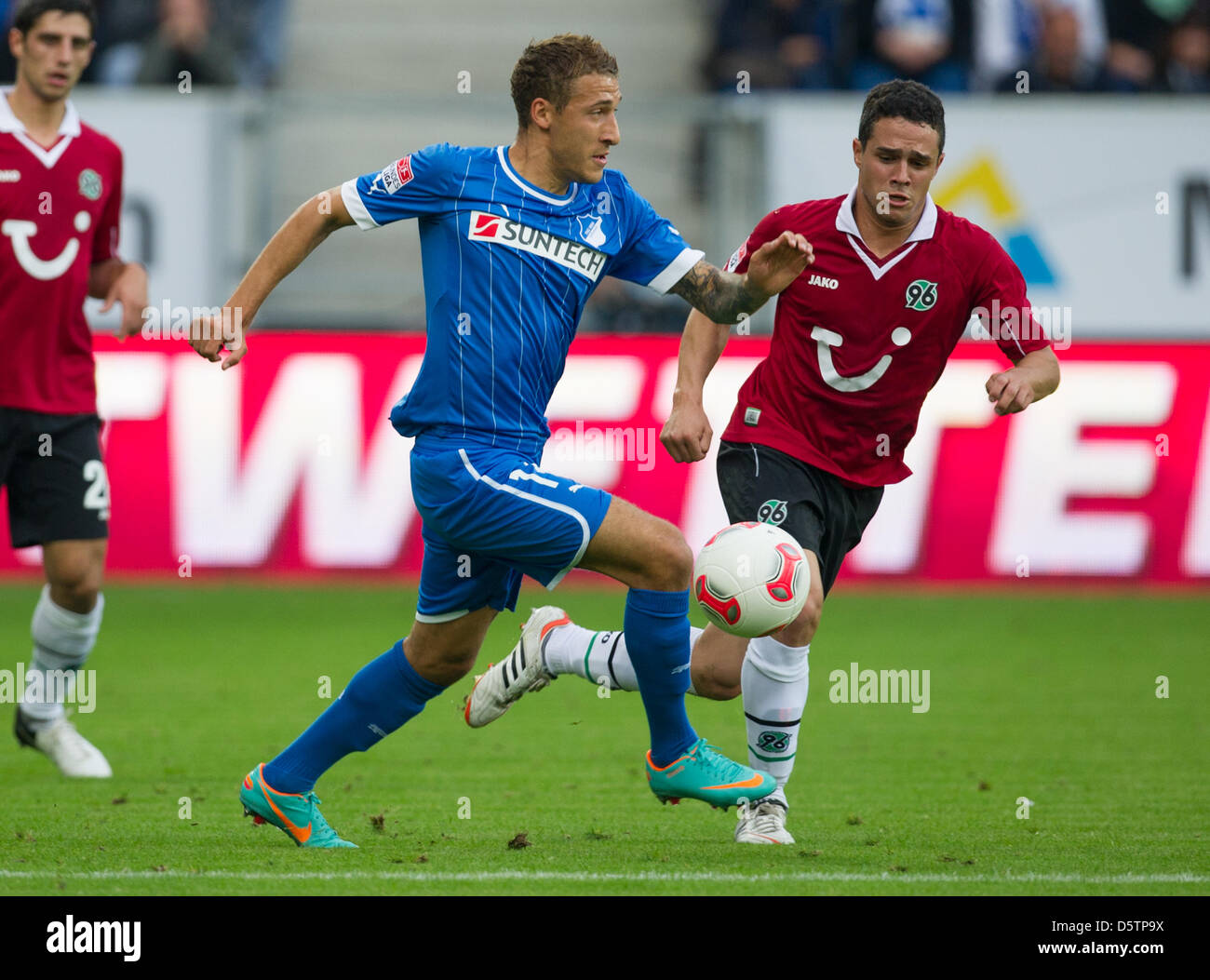 Hoffenheim's Fabian Johnson (L) and Hanover's Manuel Schmiedebach vie for the ball during the German Bundesliga soccer match 1899 Hoffenheim vs Hanover 96 at Rhein-Neckar-Arena in Sinsheim, Germany, 23 September 2012. The match ended 3:1. Photo: Uwe Anspach  (ATTENTION: EMBARGO CONDITIONS! The DFL permits the further  utilisation of up to 15 pictures only (no sequntial pictures or  Stock Photo