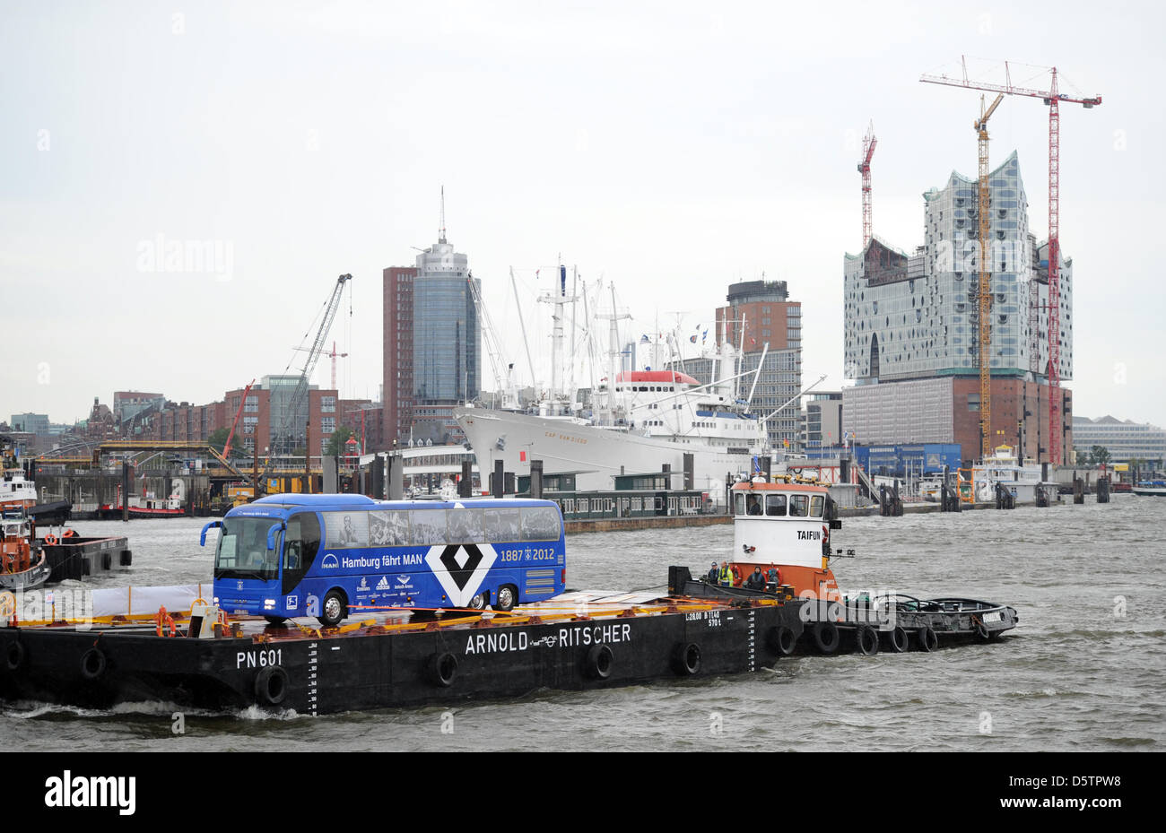 The new team bus of the German Bundesliga soccer club Hamburger SV stands on a swimming plattform for its baptism at the port of Hamburg, Germany, 24 September 2012. The bus was given the name 'Rauten-Express'. Photo: DANIEL REINHARDT Stock Photo