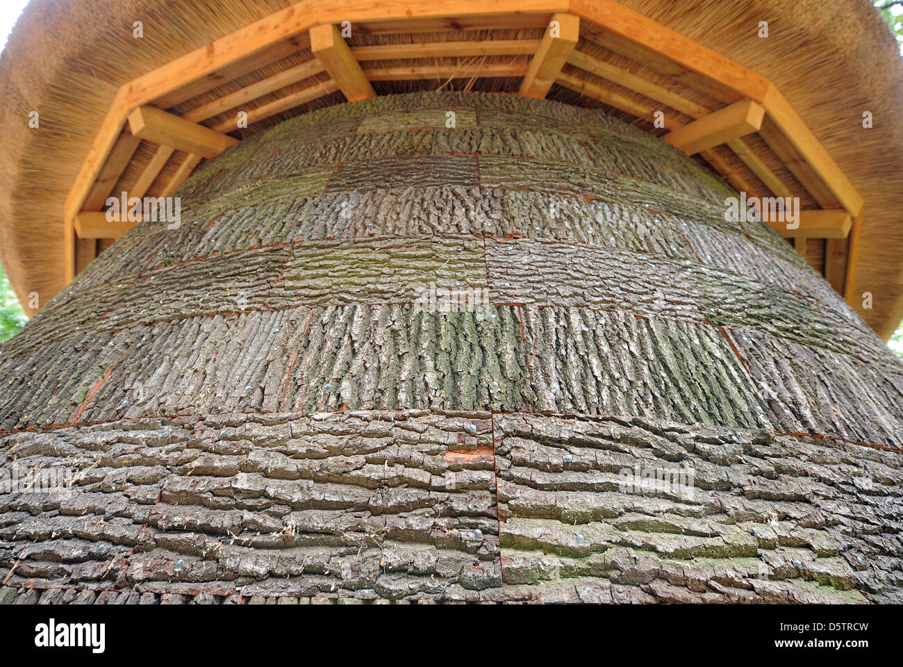 The re-built bark kitchen is covered with oak bark on the outside in ...