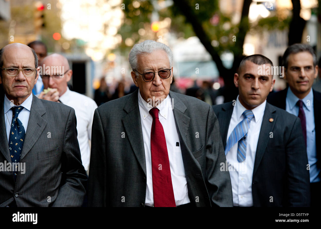 Special envoy for Syria of the United Nations and the Arab League, Lakhdar Brahimi (C), walks across the street in front of the United Nations building in New York, Germany, 25 September 2012. Photo: Sven Hoppe Stock Photo