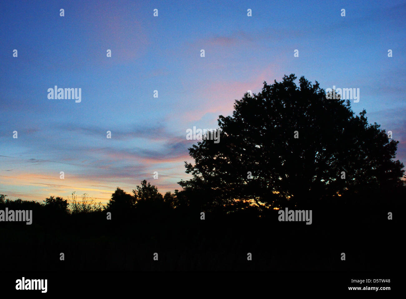 pink sky sun rise dawn hastings Brighton blue sky Stock Photo