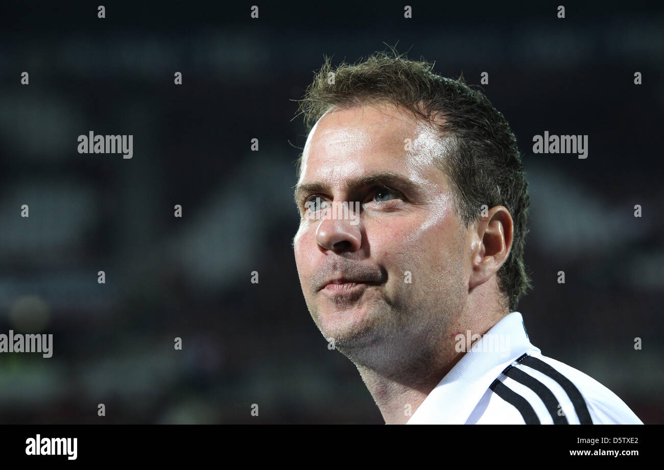 Leverkusen's head coach Sascha Lewandowski stands on the pitch before