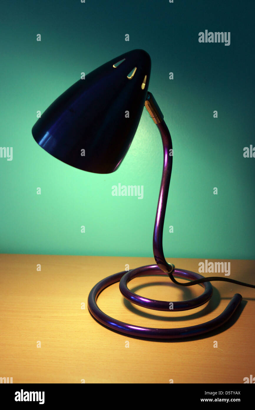 Light lamp on blue purple office desk wall colors Stock Photo