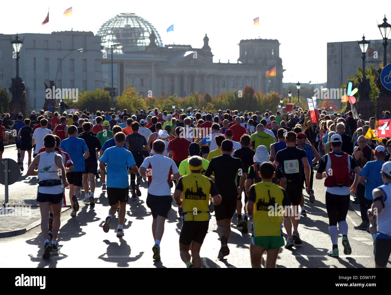 A field of runners is at the Reichstag building in Berlin, Germany, 30 ...