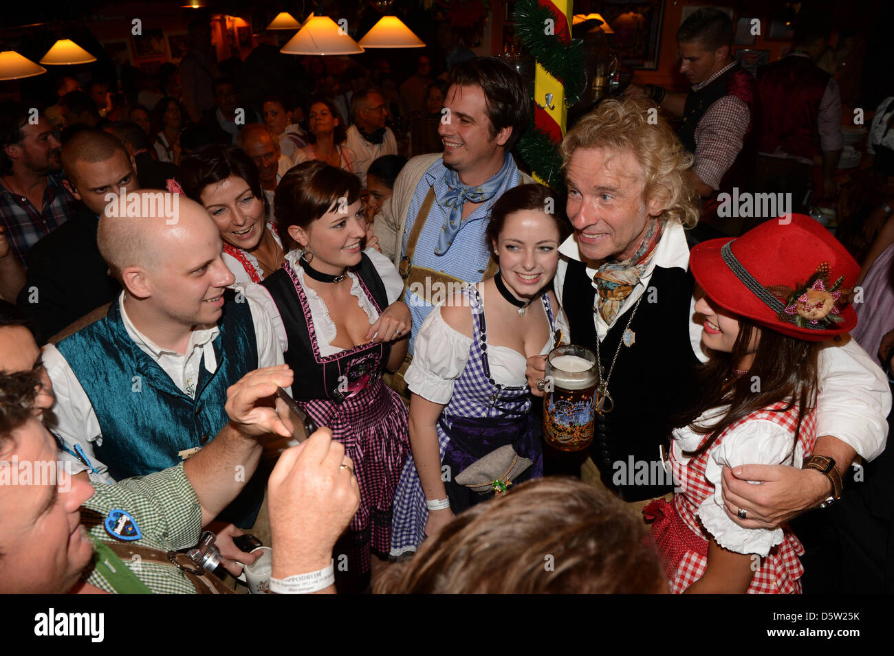 German entertainer Thomas Gottschalk (2-R) poses with fans inside the ...