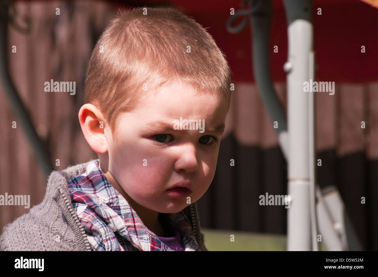 Portrait Of A 3 Year Old Boy Looking Stern Serious Stock Photo Alamy