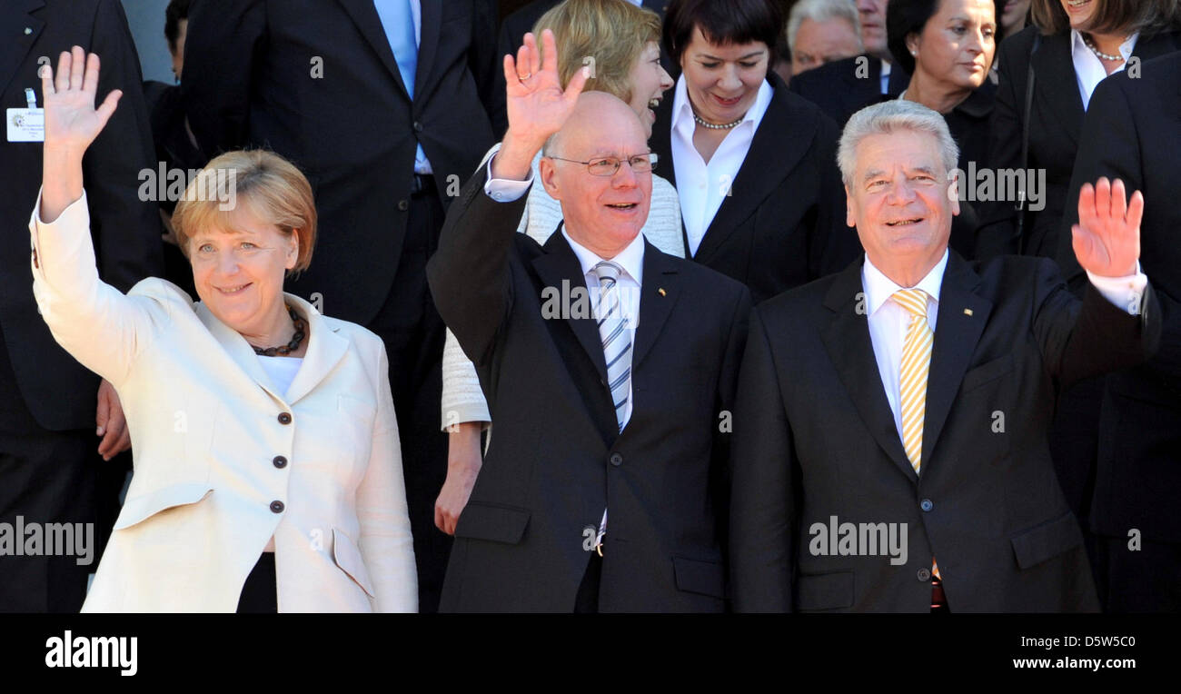 German Federal Chancellor Angela Merkel (front row L-R), President of the Bundestag Norbert Lammert and German President Joachim Gauck stand in front ot the National Theater during the official celebrations for Day of German Unity in Munich, Germany, 3 October 2012. Photo: FRANK LEONHARDT Stock Photo