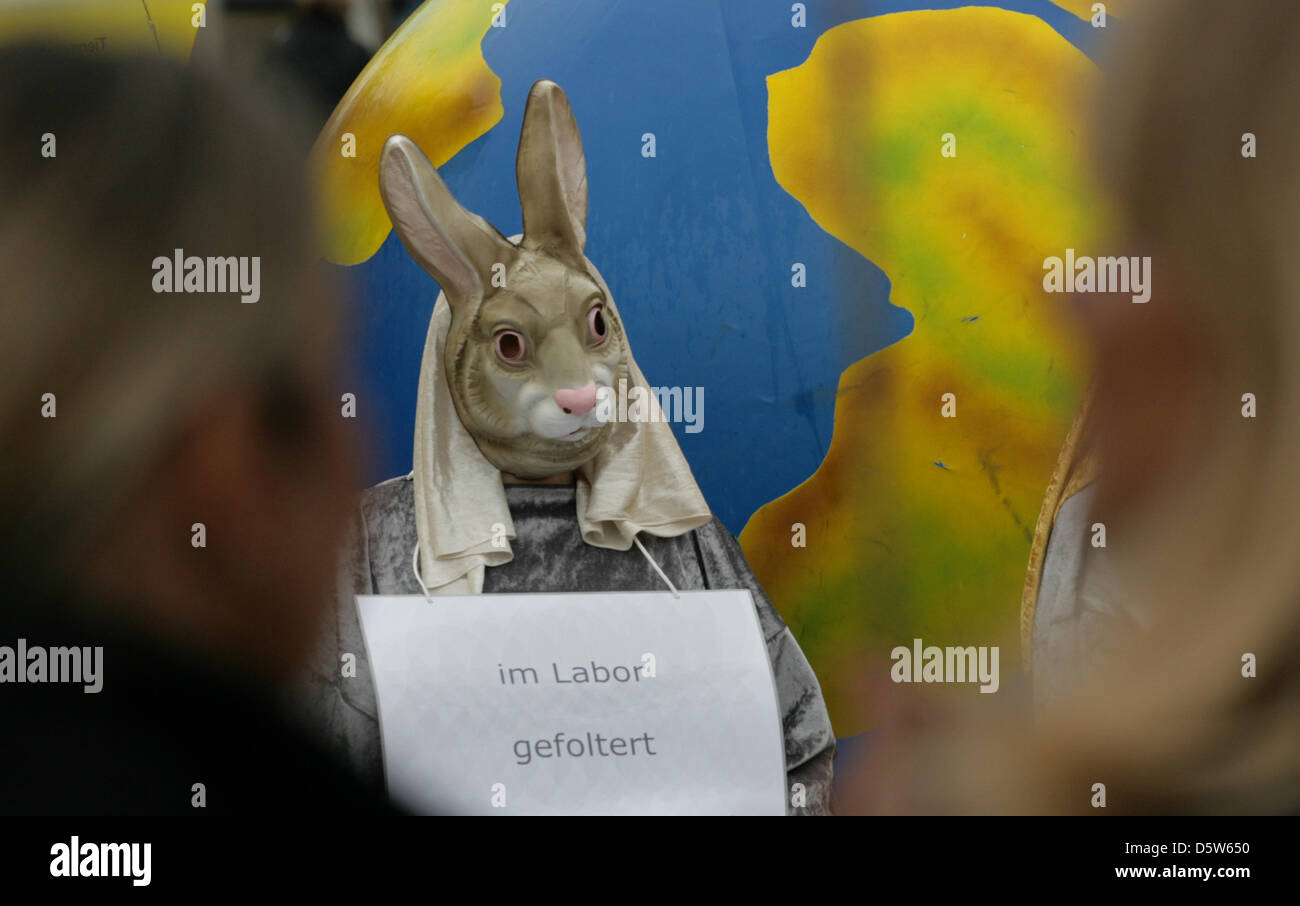 Animal rights activists demonstrate with posters and masks in front of ...