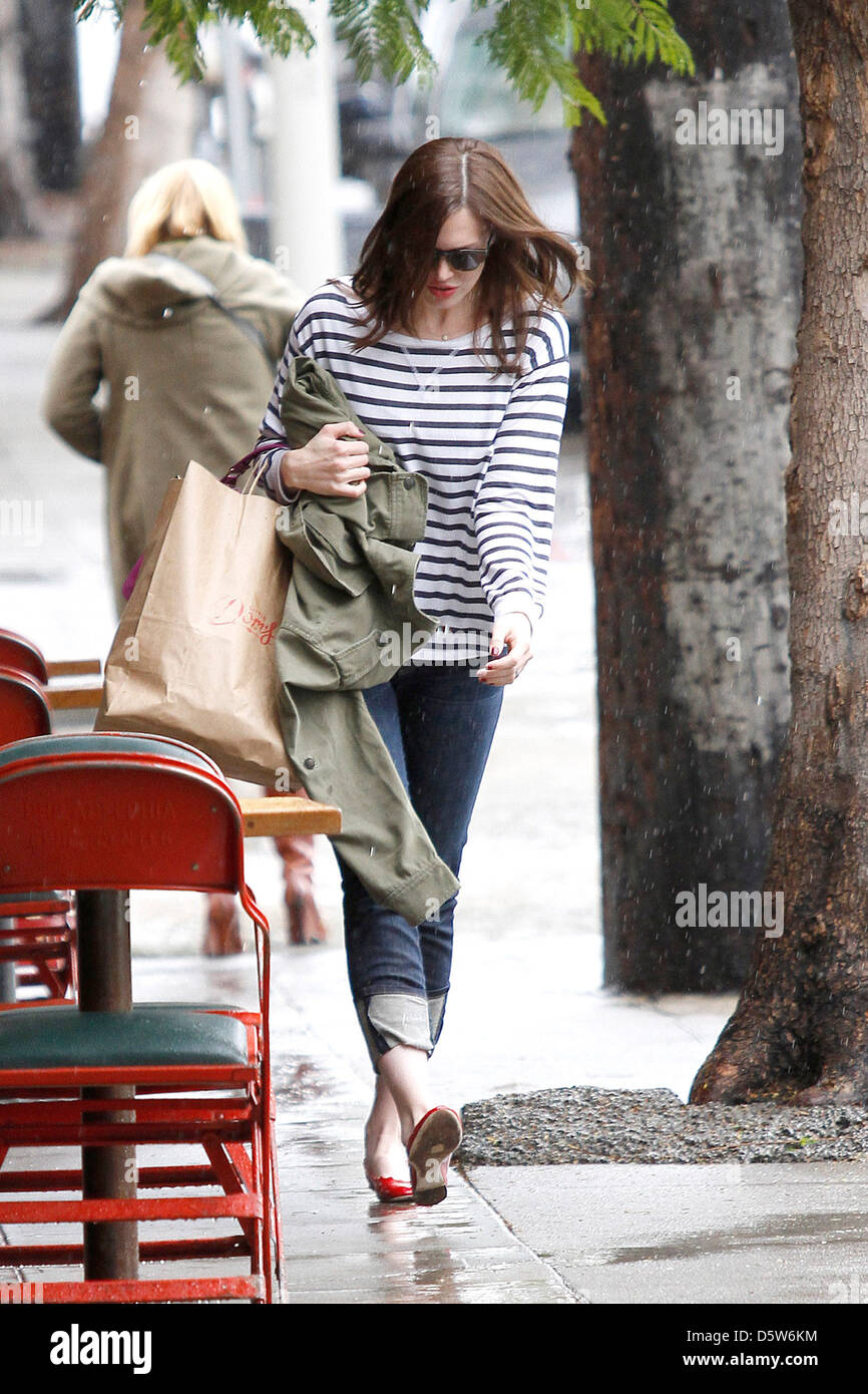 Mandy Moore is seen leaving Little Dom's restaurant in the rain after