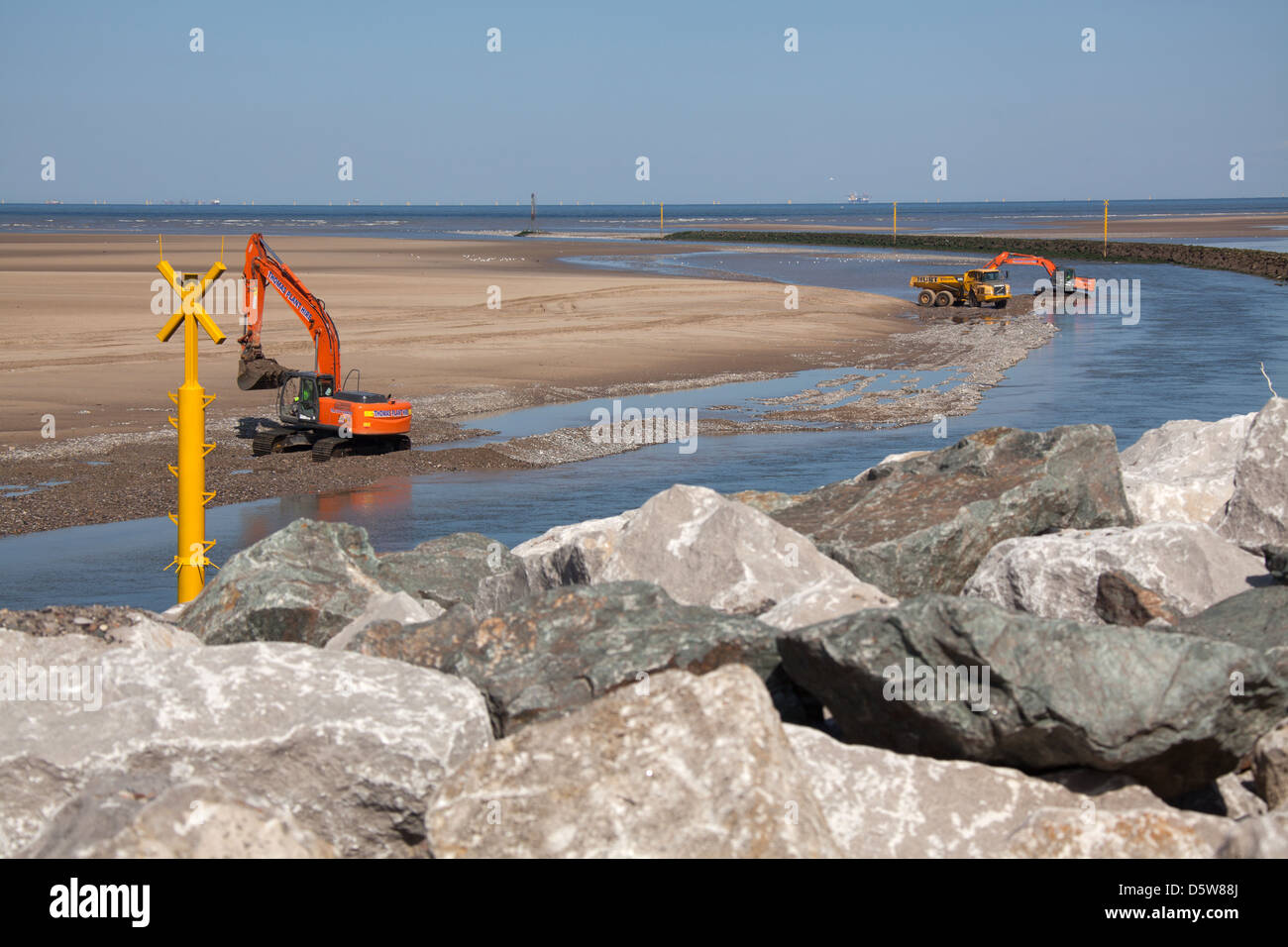 The Wales Coastal Path in North Wales. Excavation works on the River Clwyd at Rhyl Harbour. Stock Photo