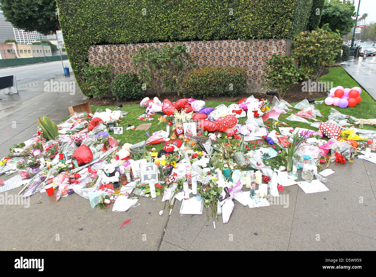 Fans pay tribute to Whitney Houston outside the Beverly Hilton Hotel in Beverly Hills Los Angeles, California - 15.02.12 Stock Photo