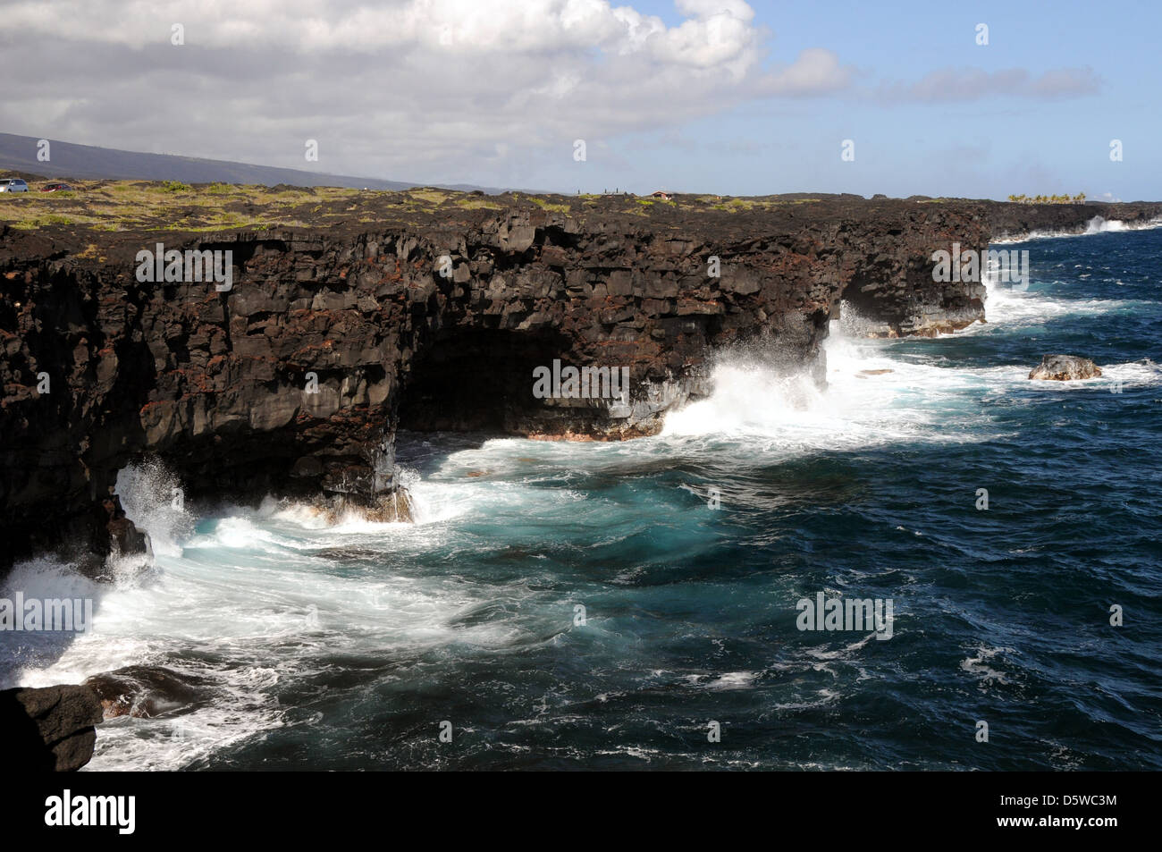 Lava sea cliffs at the end of The Chain of Craters Road in the Volcanoes National Park, Big Island, Hawaii. Stock Photo