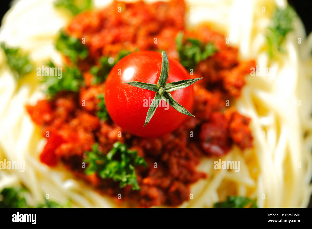 Spaghetti bolognese with fresh parsley and tomato Stock Photo Alamy