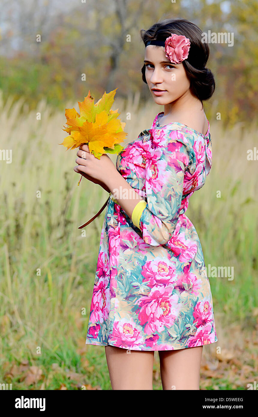 The young girl in autumn park Stock Photo - Alamy