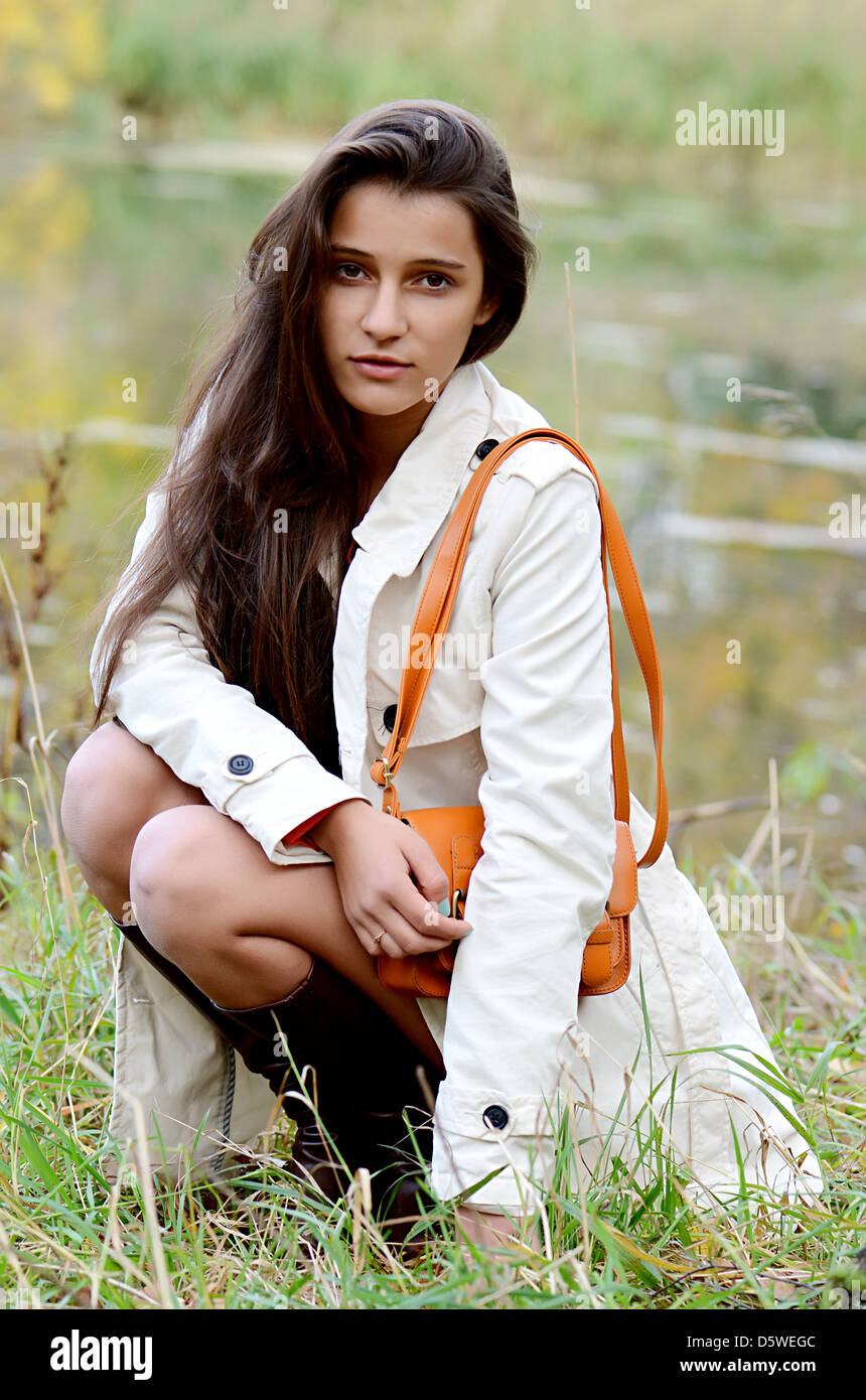 Beautiful young girl in autumn park Stock Photo - Alamy