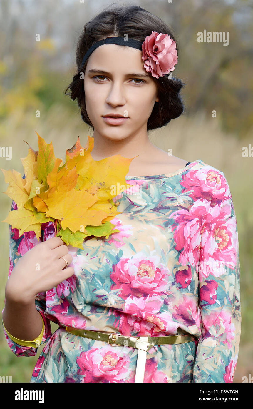 The young girl in autumn park Stock Photo - Alamy