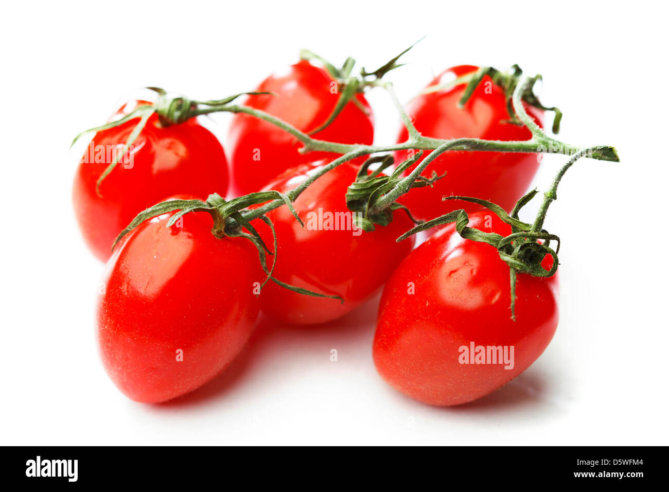 Bunch of cherry tomatoes isolated on white background Stock Photo - Alamy