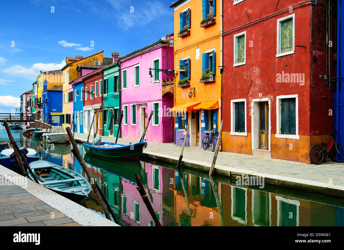 Colorful buildings in Burano island sunny street, Venise, Italy Stock Photo