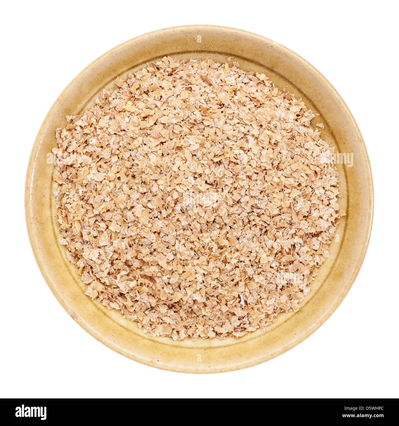wheat bran in a small ceramic bowl isolated on white, top view Stock Photo