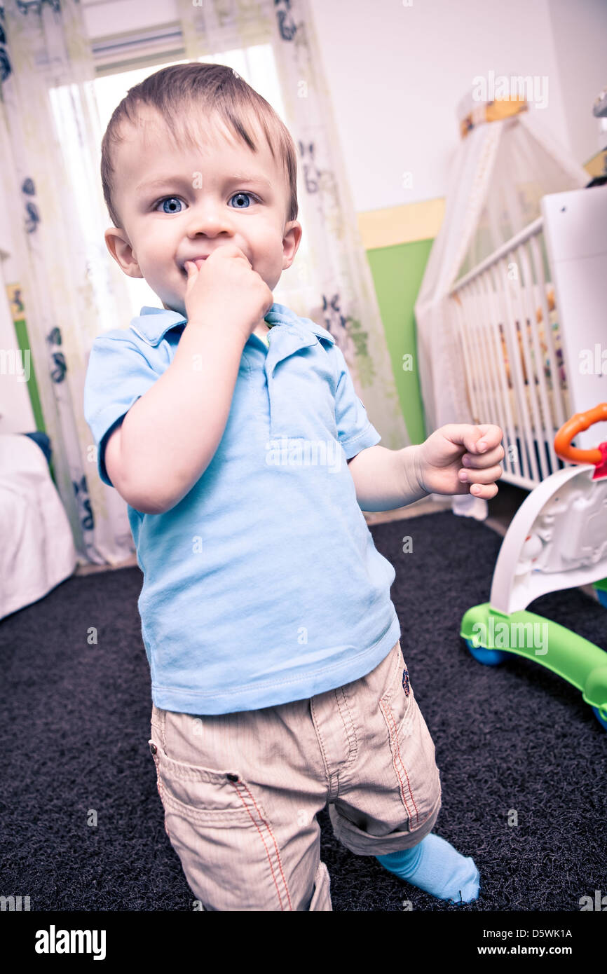 little toddler playing in the child's room Stock Photo