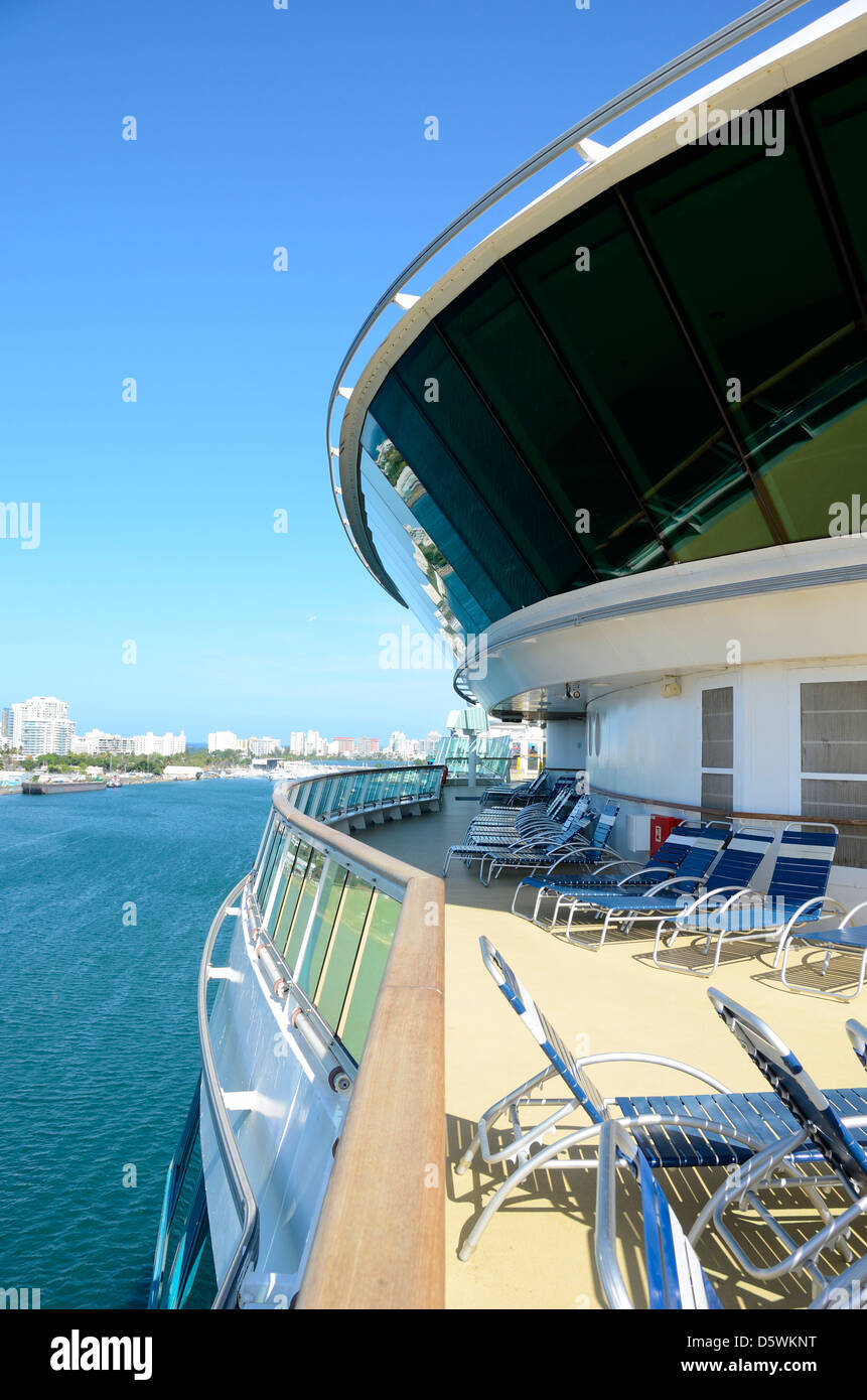 Side view of cruise ship deck and lounge chairs in San Juan. Stock Photo