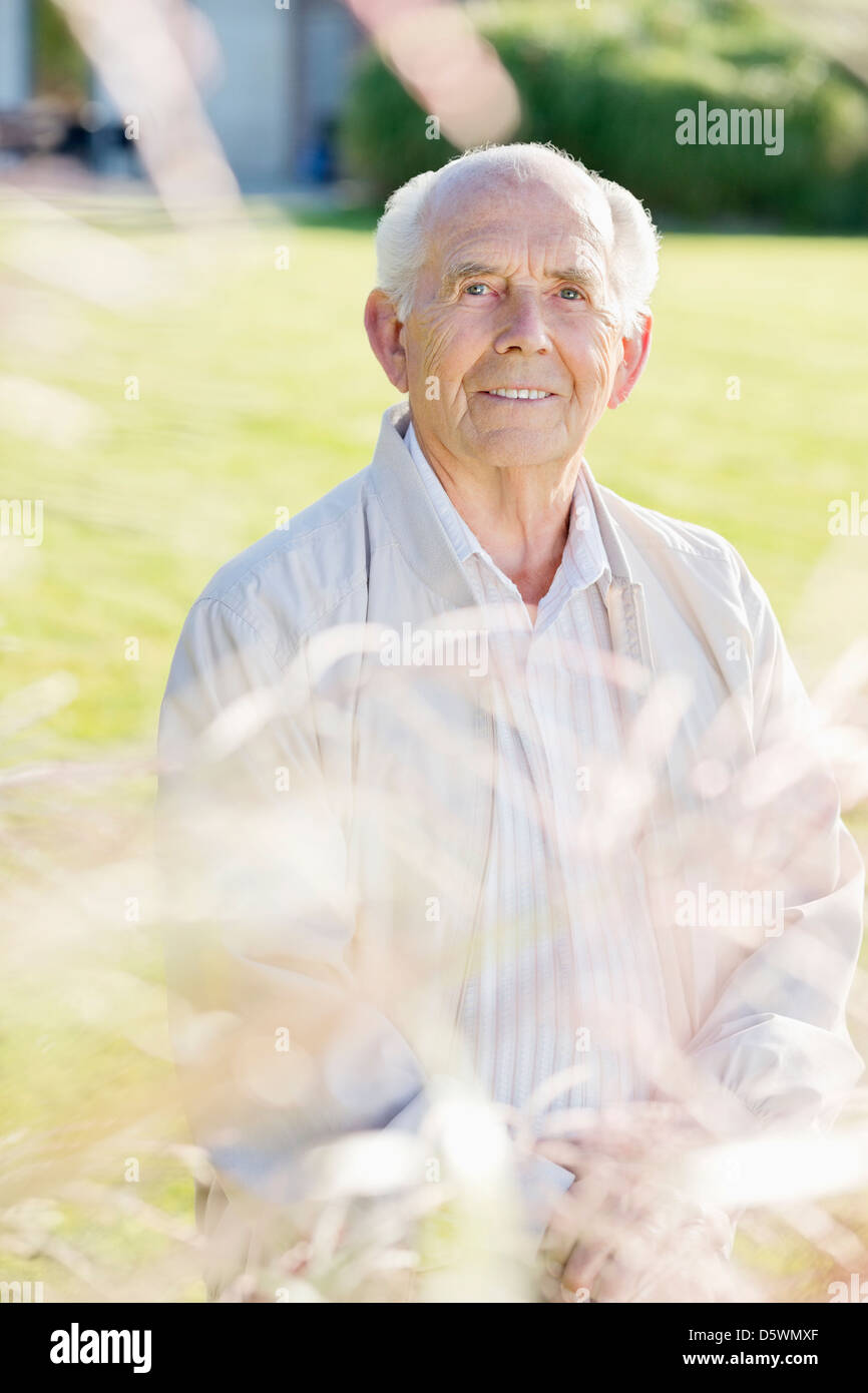 Standing outdoors man in white hi-res stock photography and images - Alamy