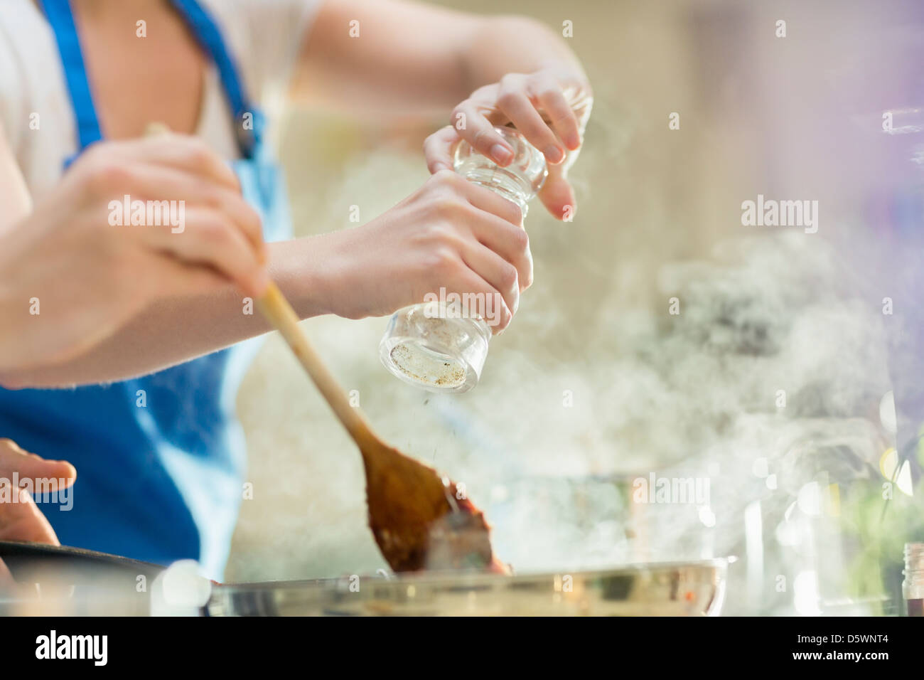 Couple cooking in kitchen Stock Photo